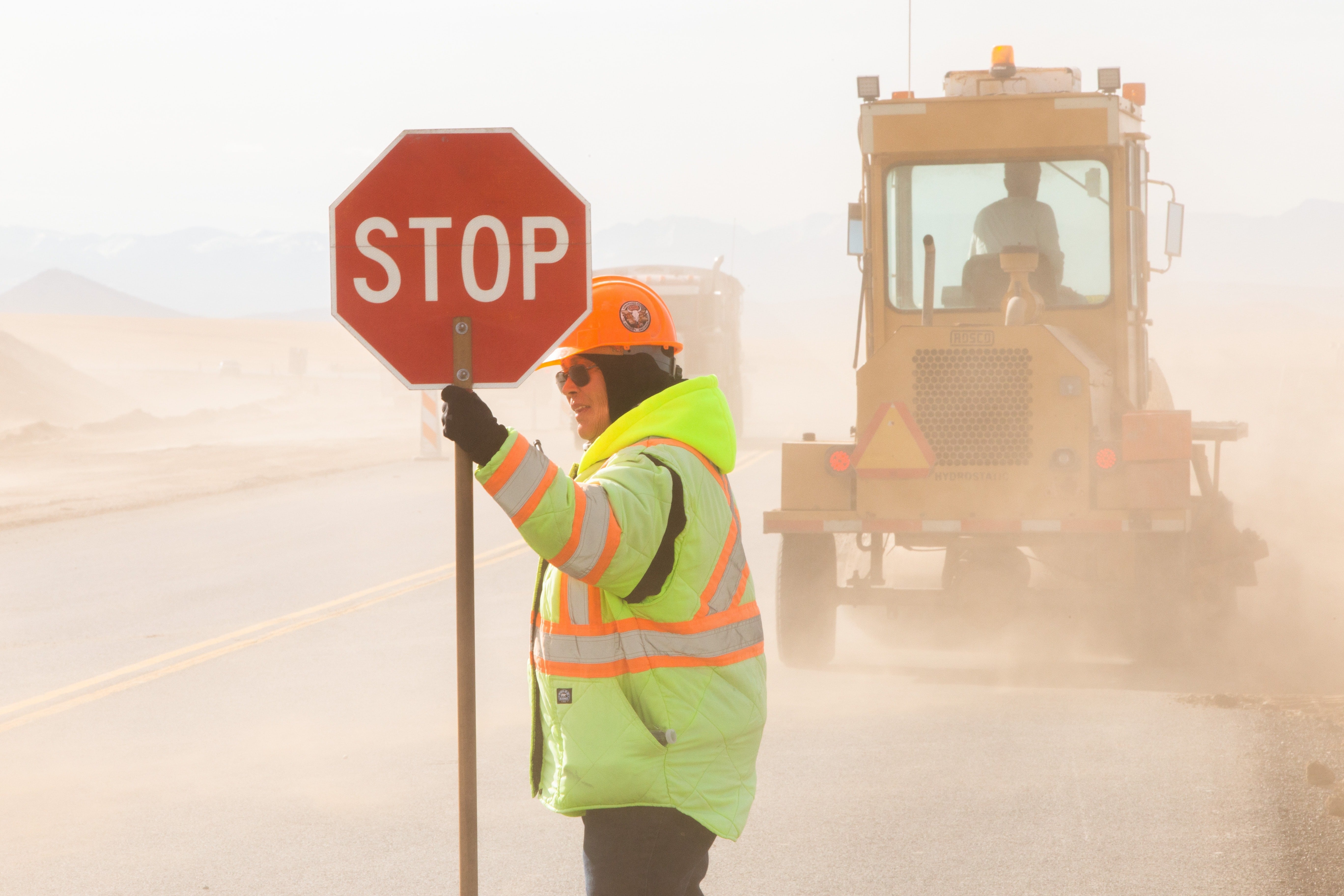 Man holding a stop signage