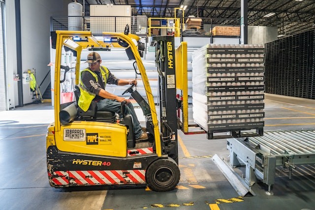 Forklift in the warehouse with line marking